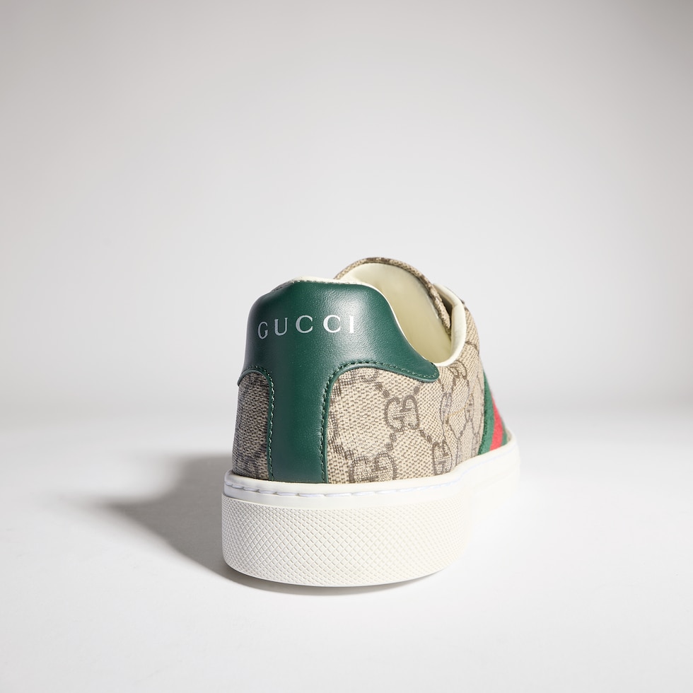 米色和乌木色GG Supreme帆布Gucci Ace系列饰织带女士运动鞋 -古驰GUCCI中国官方网站